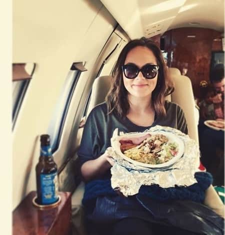 Brittany Favre having her lunch in a private jet